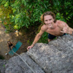 a man climbing a rock wall