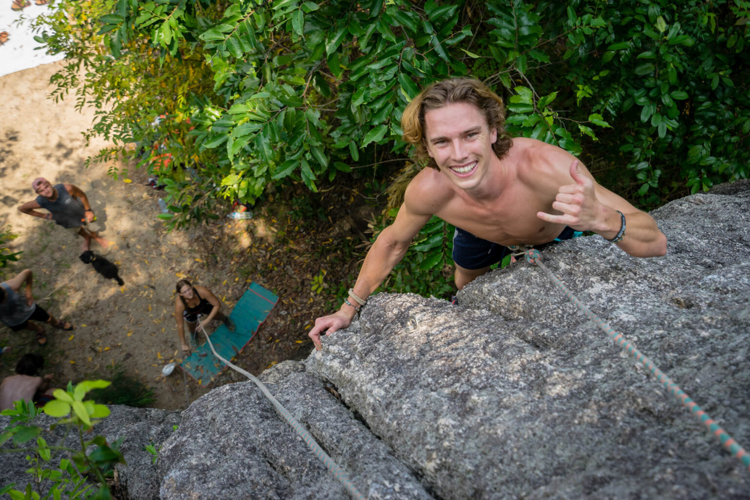 a man climbing a rock wall